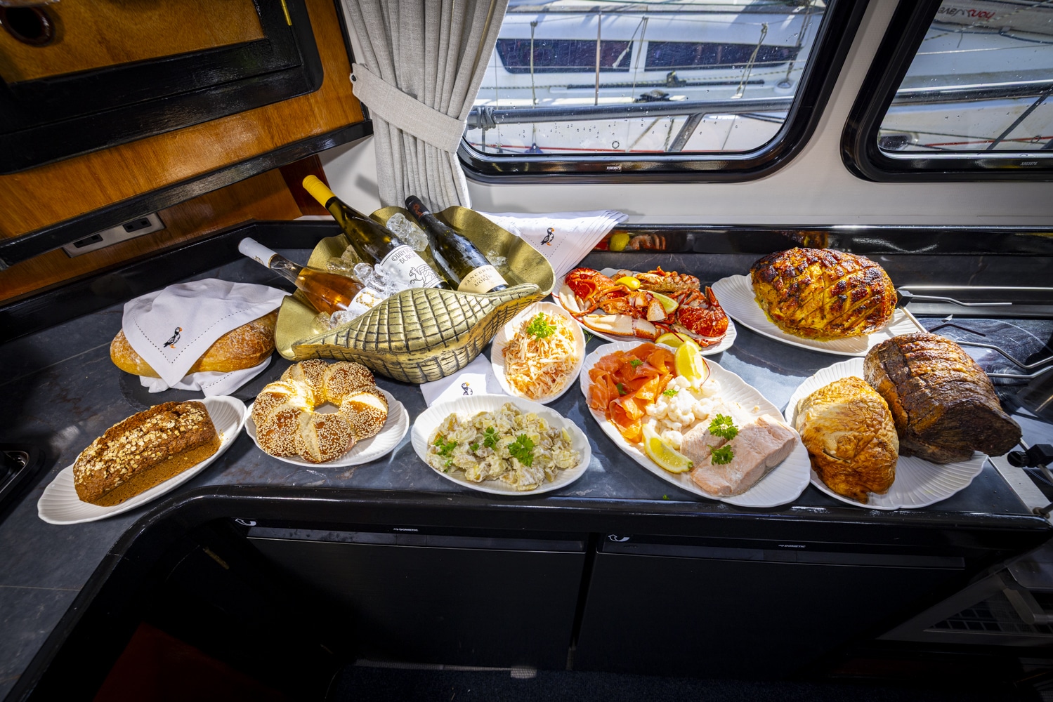 Freshly prepared seafood platter served onboard a Puifin charter